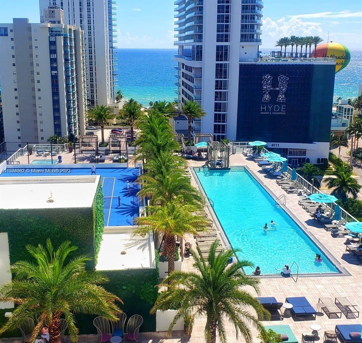 4010 South Ocean Drive, Unit R1005 Hollywood, FL 33019 - Photo 2 of 14 a view of backyard with outdoor seating and plants