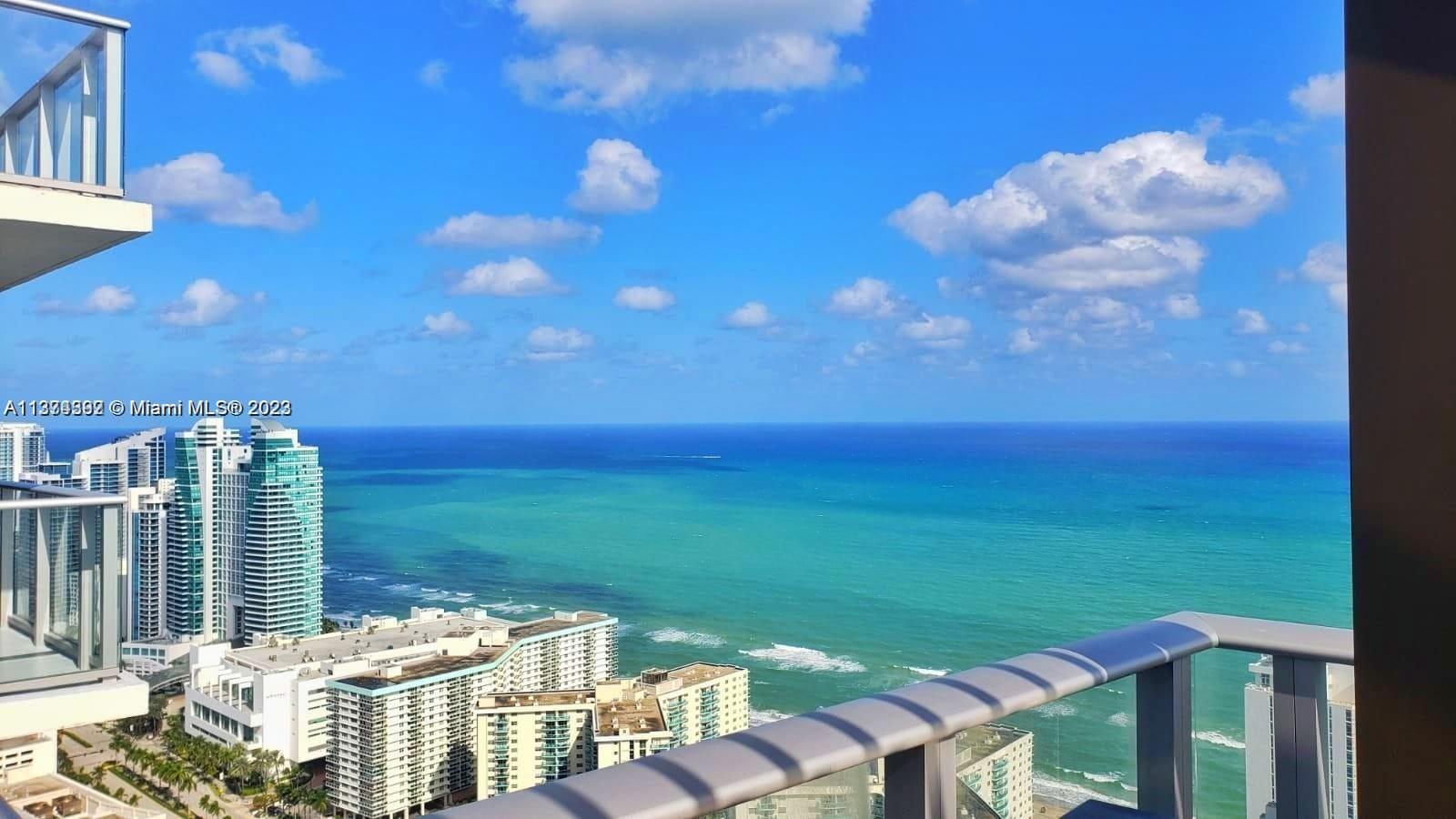 4010 South Ocean Drive, Unit R1005 Hollywood, FL 33019 - Photo 3 of 14 a view of a balcony with two chairs