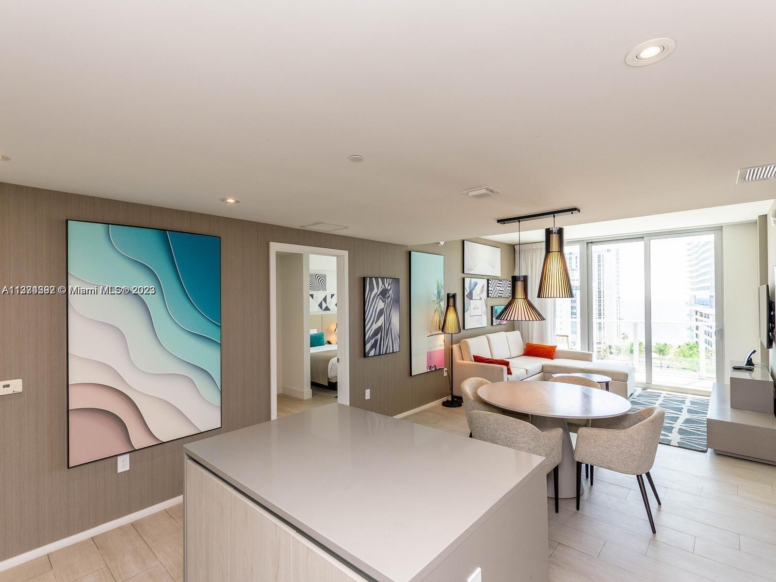 4010 South Ocean Drive, Unit R1005 Hollywood, FL 33019 - Photo 5 of 14 a living room with furniture a window and a table