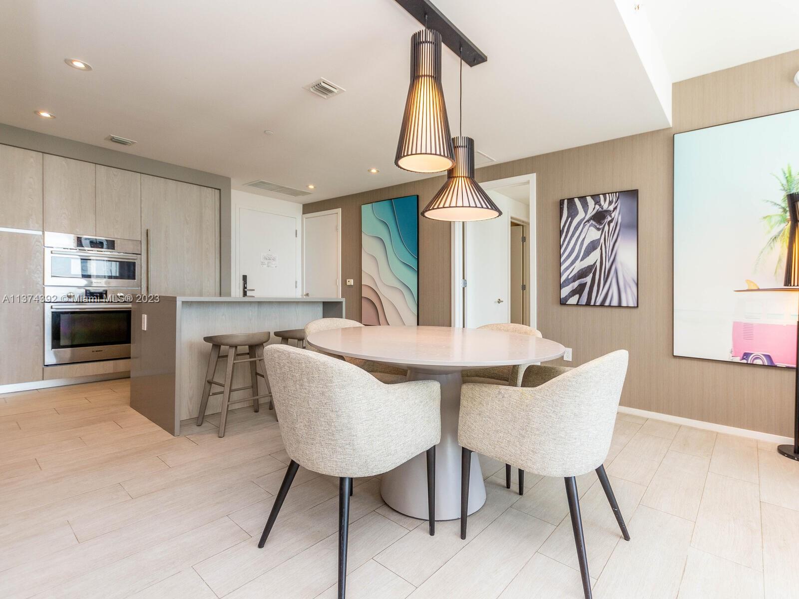 4010 South Ocean Drive, Unit R1005 Hollywood, FL 33019 - Photo 9 of 14 a view of a dining room with furniture