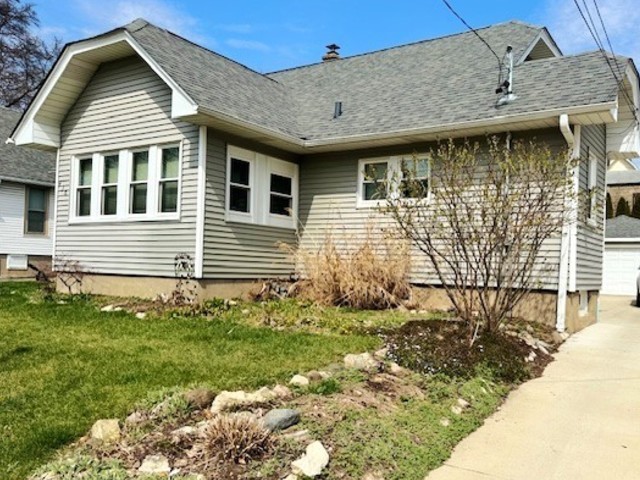 430 Enterprise Street Elgin, IL 60120 - Photo 2 of 18 a front view of a house with garden