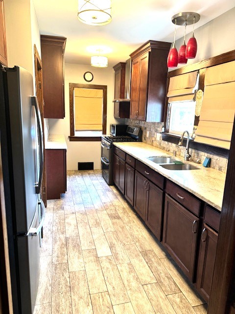 430 Enterprise Street Elgin, IL 60120 - Photo 4 of 18 a bathroom with a sink vanity and mirror