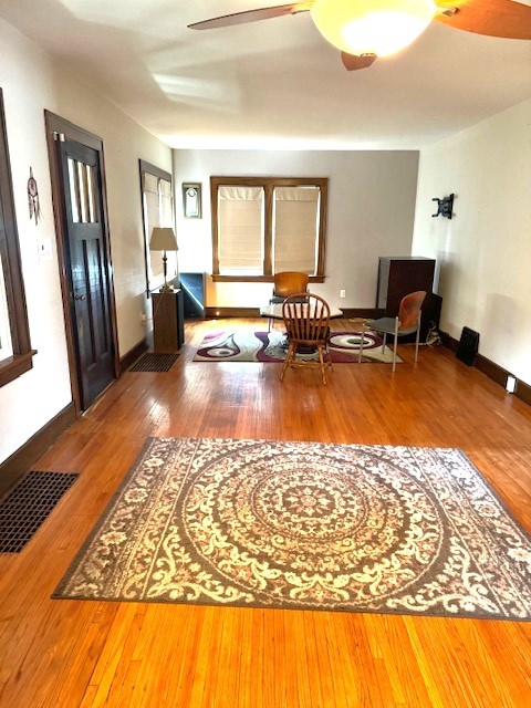 430 Enterprise Street Elgin, IL 60120 - Photo 7 of 18 a living room with furniture rug and a table
