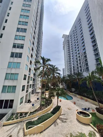 a view of building with yard and staircase