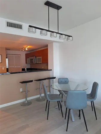 a view of a chairs and table in a room