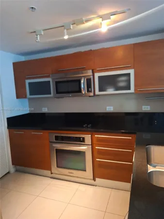 a kitchen with a stove and a microwave