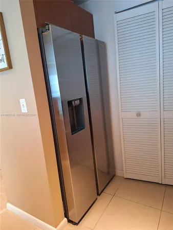 a view of a refrigerator in a kitchen