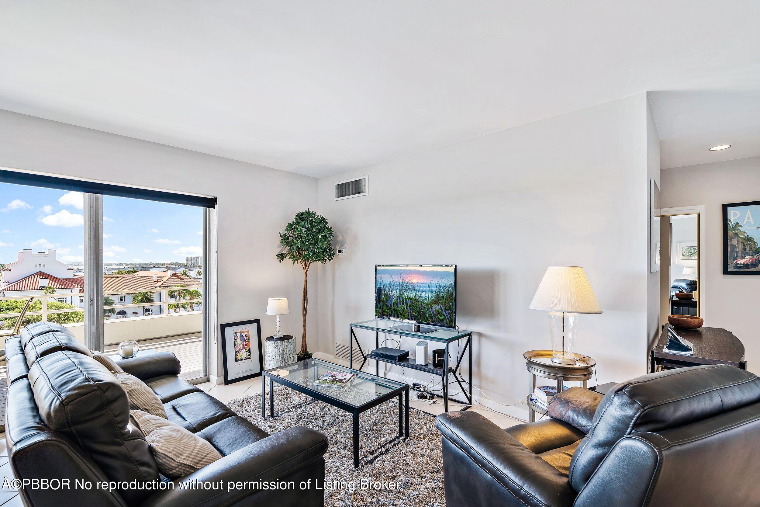 44 Cocoanut Row, Unit 626B Palm Beach, FL 33480 - Photo 2 of 12 a living room with furniture and a lamp