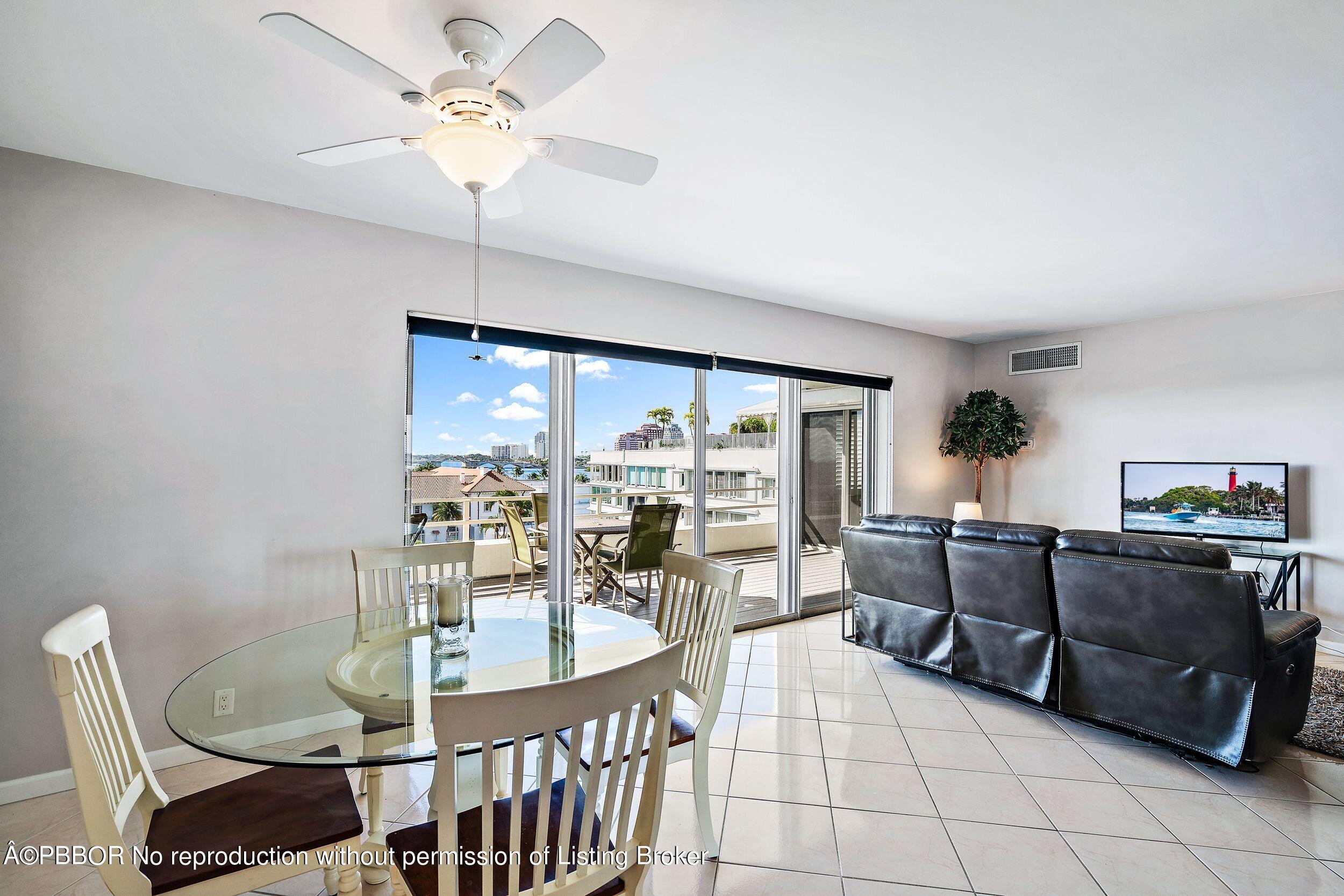 44 Cocoanut Row, Unit 626B Palm Beach, FL 33480 - Photo 4 of 12 a living room with furniture a chandelier and a dining table