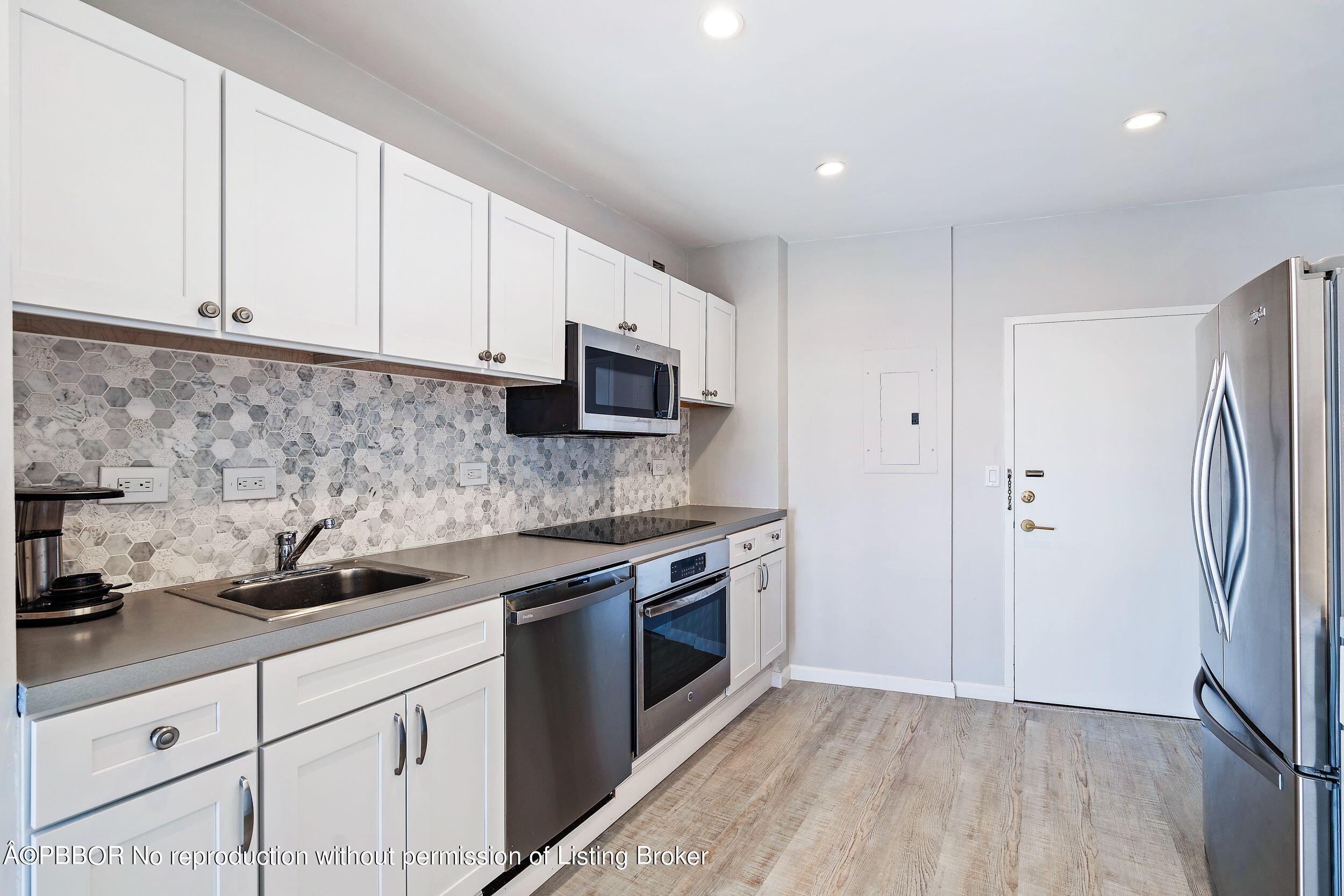 44 Cocoanut Row, Unit 626B Palm Beach, FL 33480 - Photo 6 of 12 a kitchen with stainless steel appliances granite countertop a sink a stove a refrigerator and cabinets