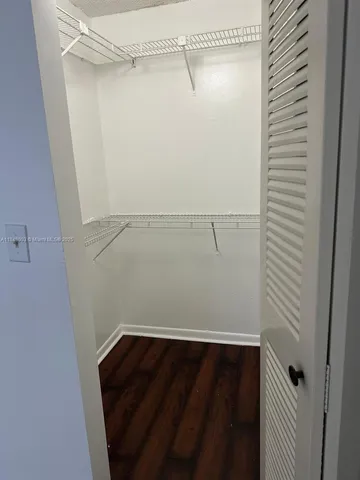 a view of a room with racks on the wall