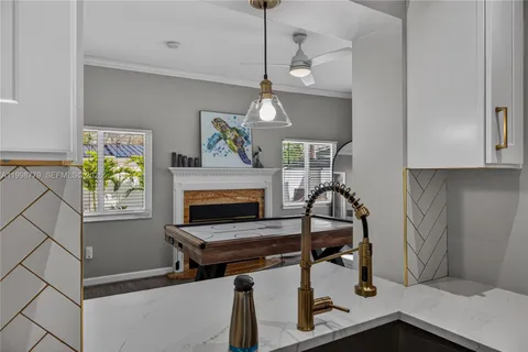 a kitchen with stainless steel appliances a stove a microwave and cabinets
