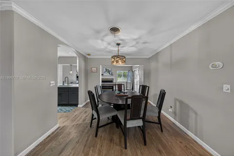 a living room with furniture a fireplace and a table