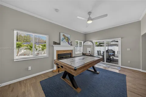 a view of a livingroom with furniture window and wooden floor