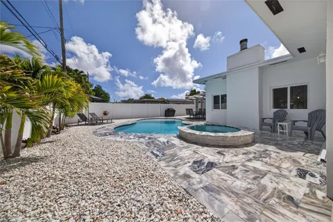 an aerial view of a house with swimming pool