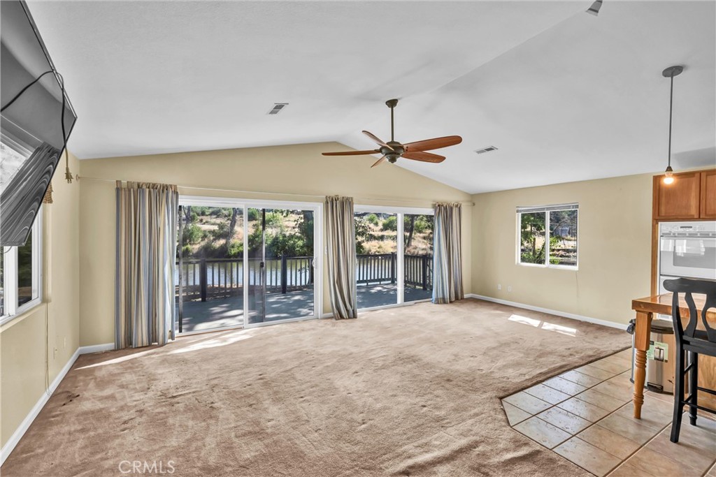 16410 Tish-A-Tang Road Lower Lake, CA 95457 - Photo 36 of 48 a view of a livingroom with a flat screen tv and windows