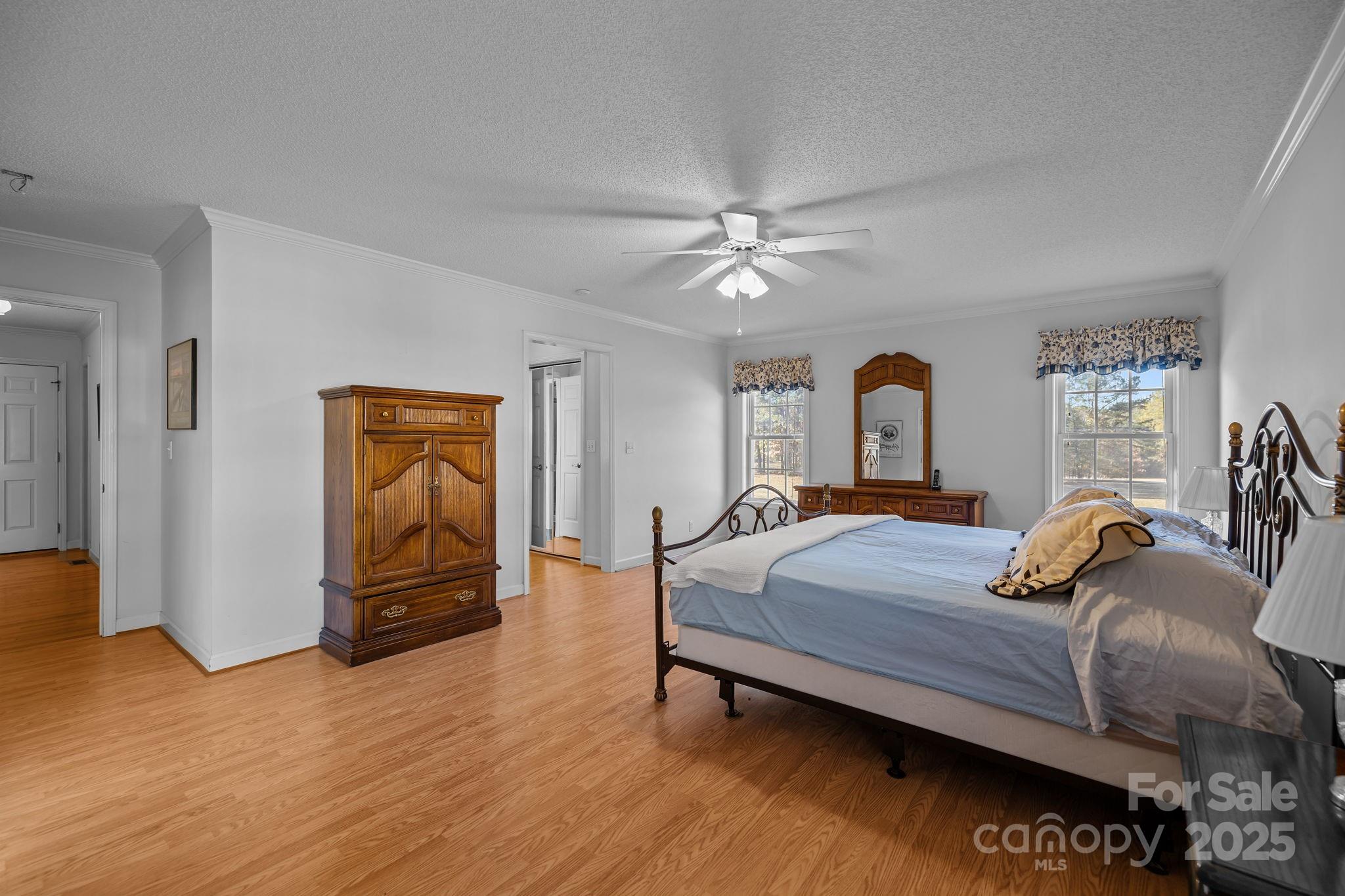 2363 Armenia Road Chester, SC 29706 - Photo 18 of 36 a bedroom with a bed and a chandelier