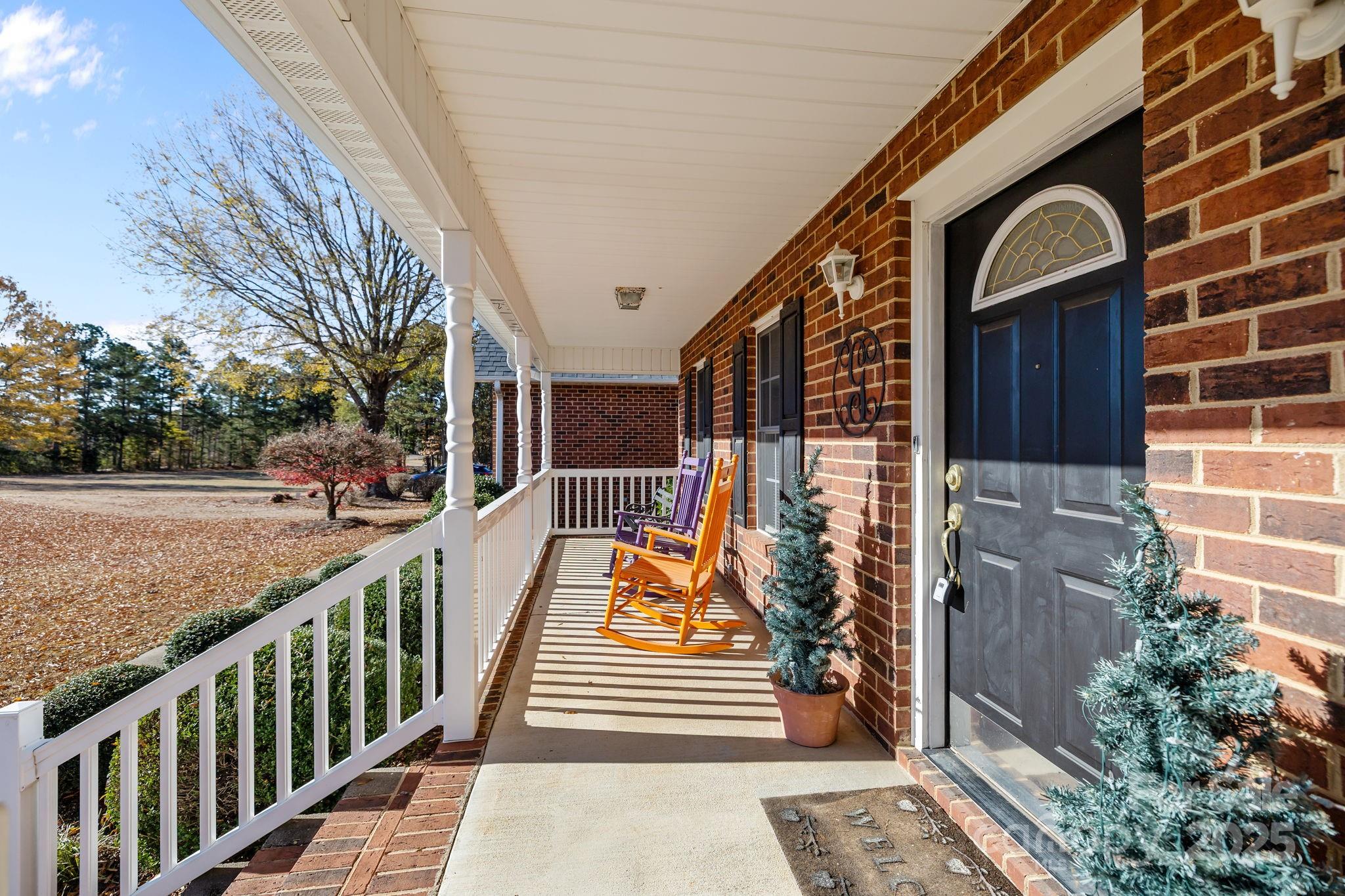 2363 Armenia Road Chester, SC 29706 - Photo 21 of 36 a view of a balcony with wooden floor and potted plants