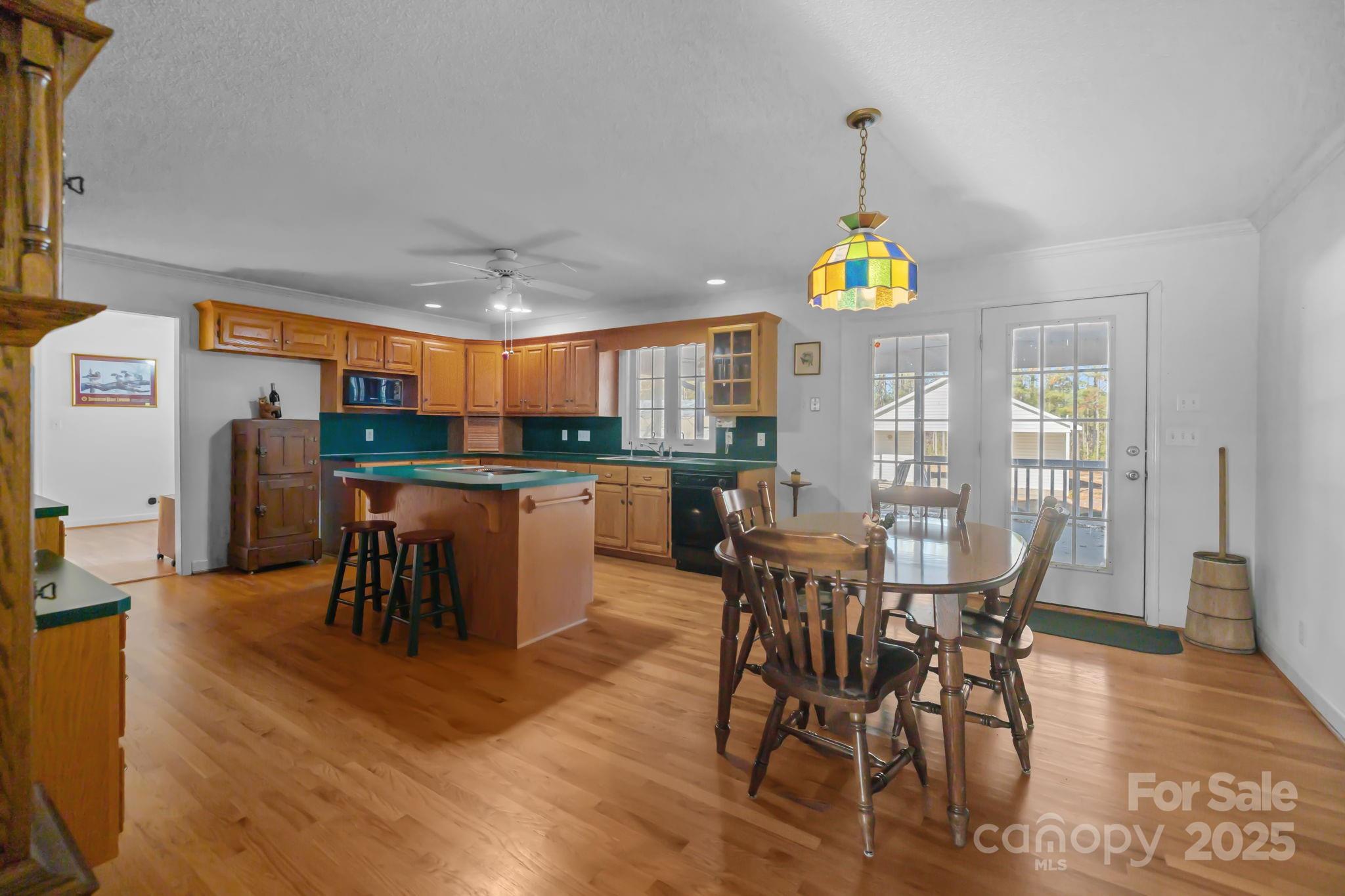 2363 Armenia Road Chester, SC 29706 - Photo 8 of 36 a dining room with furniture a chandelier and wooden floor