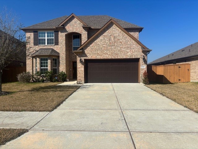 10818 Bodie Hls Drive Rosharon, TX 77583 - Photo 1 of 21 a front view of a house with yard