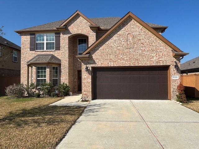 10818 Bodie Hls Drive Rosharon, TX 77583 - Photo 2 of 21 a front view of a house with yard