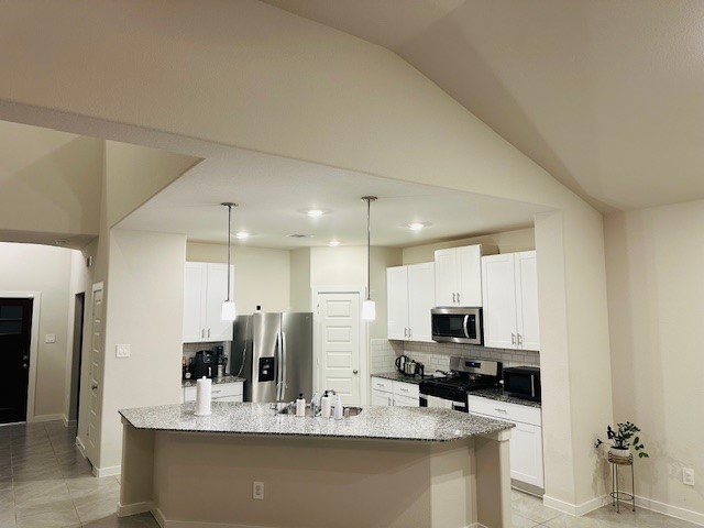 10818 Bodie Hls Drive Rosharon, TX 77583 - Photo 4 of 21 a view of a kitchen with kitchen island granite countertop a sink and cabinets