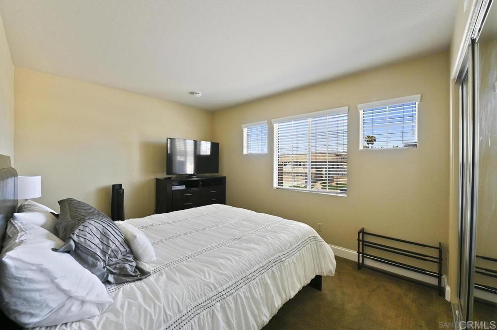 1035 Park Meadows Road Chula Vista, CA 91915 - Photo 20 of 35 a bedroom with a bed and a tv