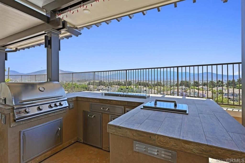 1035 Park Meadows Road Chula Vista, CA 91915 - Photo 28 of 35 a roof deck with a table and chairs