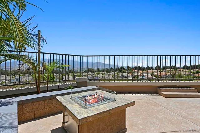 a view of a grassy field with trees
