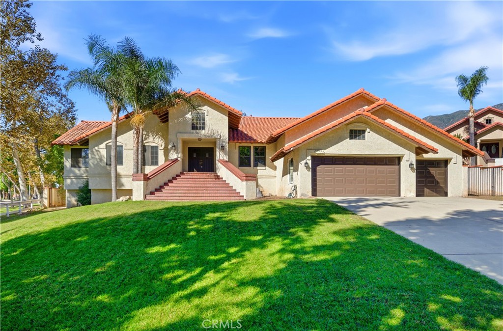 5498 Shadow Lane Rancho Cucamonga, CA 91737 - Photo 1 of 51 a front view of a house with a yard and garage