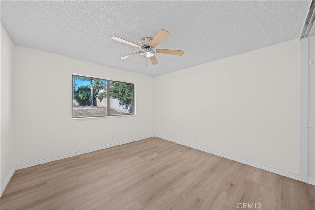 5498 Shadow Lane Rancho Cucamonga, CA 91737 - Photo 14 of 51 a view of empty room with wooden floor