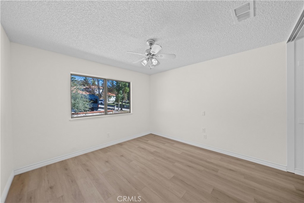 5498 Shadow Lane Rancho Cucamonga, CA 91737 - Photo 16 of 51 an empty room with a window and a ceiling fan