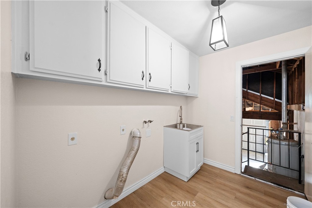 5498 Shadow Lane Rancho Cucamonga, CA 91737 - Photo 20 of 51 a view of a storage and utility room with wooden floor