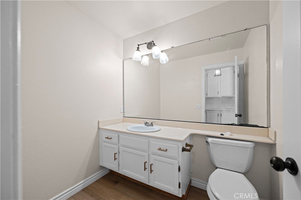 5498 Shadow Lane Rancho Cucamonga, CA 91737 - Photo 28 of 51 a bathroom with a toilet sink and mirror