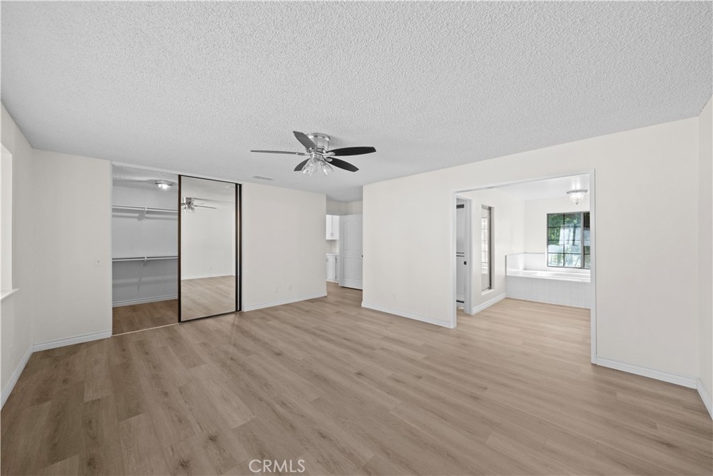 5498 Shadow Lane Rancho Cucamonga, CA 91737 - Photo 30 of 51 a view of an empty room with wooden floor