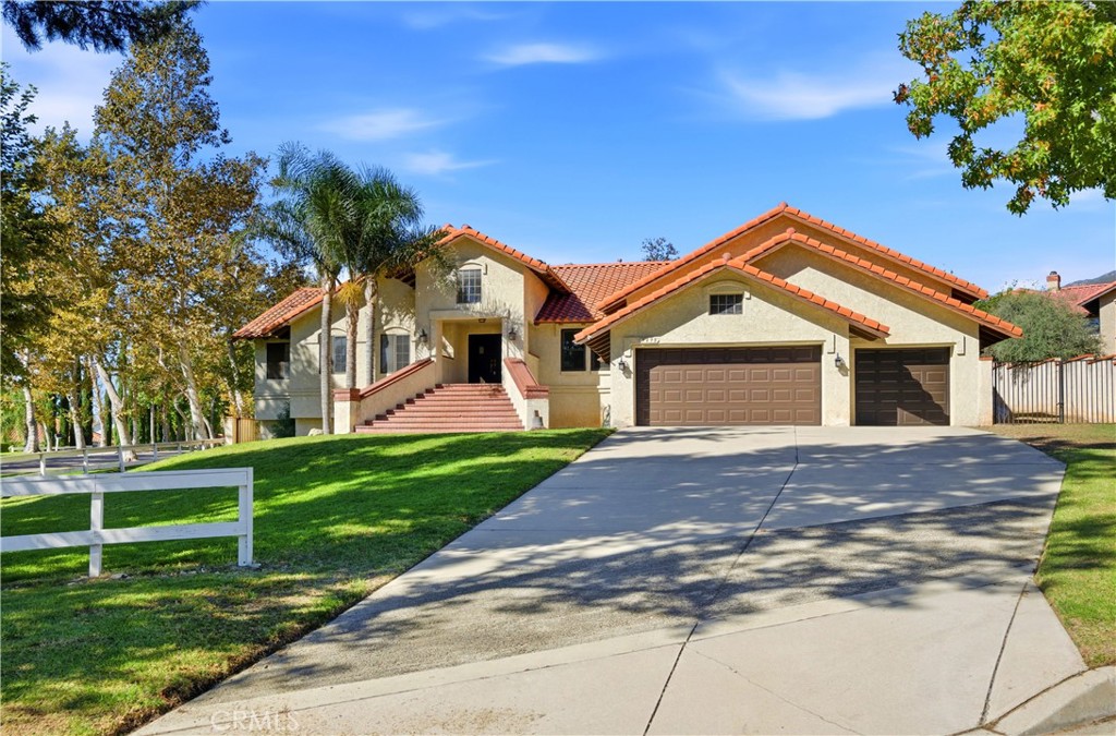 5498 Shadow Lane Rancho Cucamonga, CA 91737 - Photo 3 of 51 a front view of a house with a yard