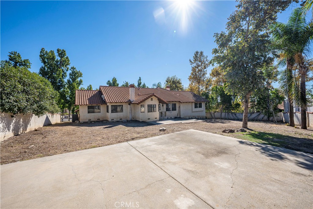 5498 Shadow Lane Rancho Cucamonga, CA 91737 - Photo 39 of 51 a view of a house with a yard and large trees