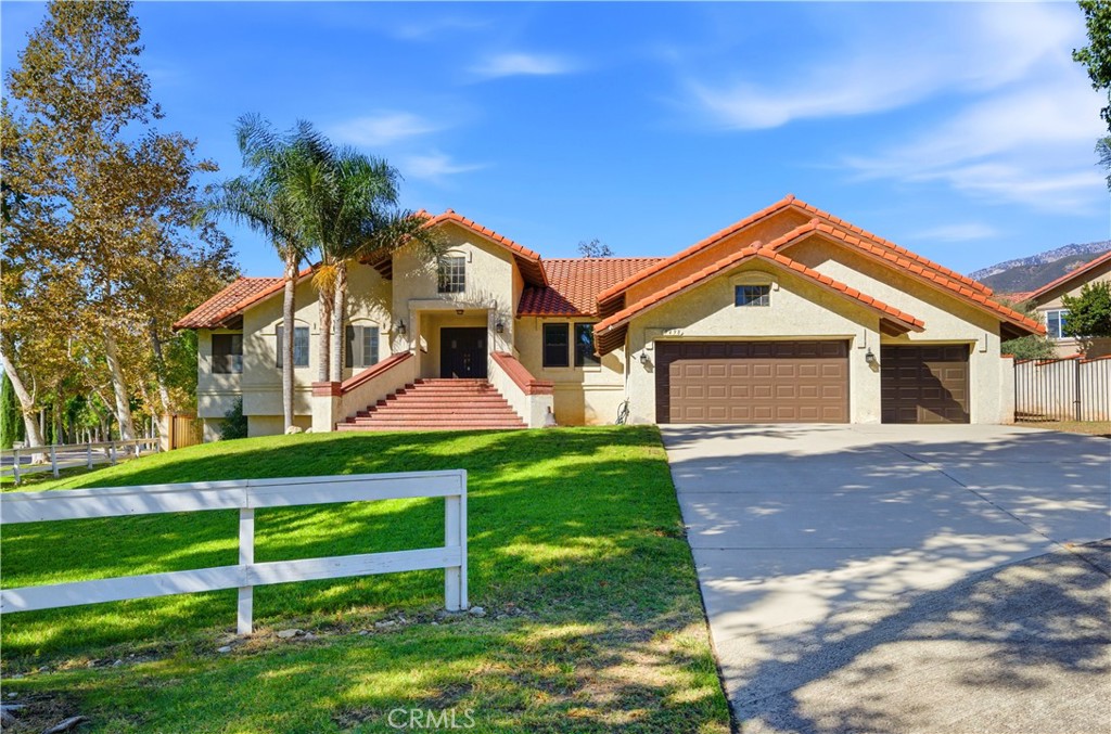 5498 Shadow Lane Rancho Cucamonga, CA 91737 - Photo 4 of 51 a front view of a house with a yard