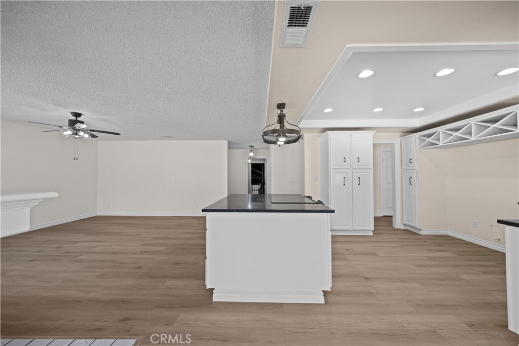 5498 Shadow Lane Rancho Cucamonga, CA 91737 - Photo 9 of 51 a view of a kitchen with a sink and a refrigerator