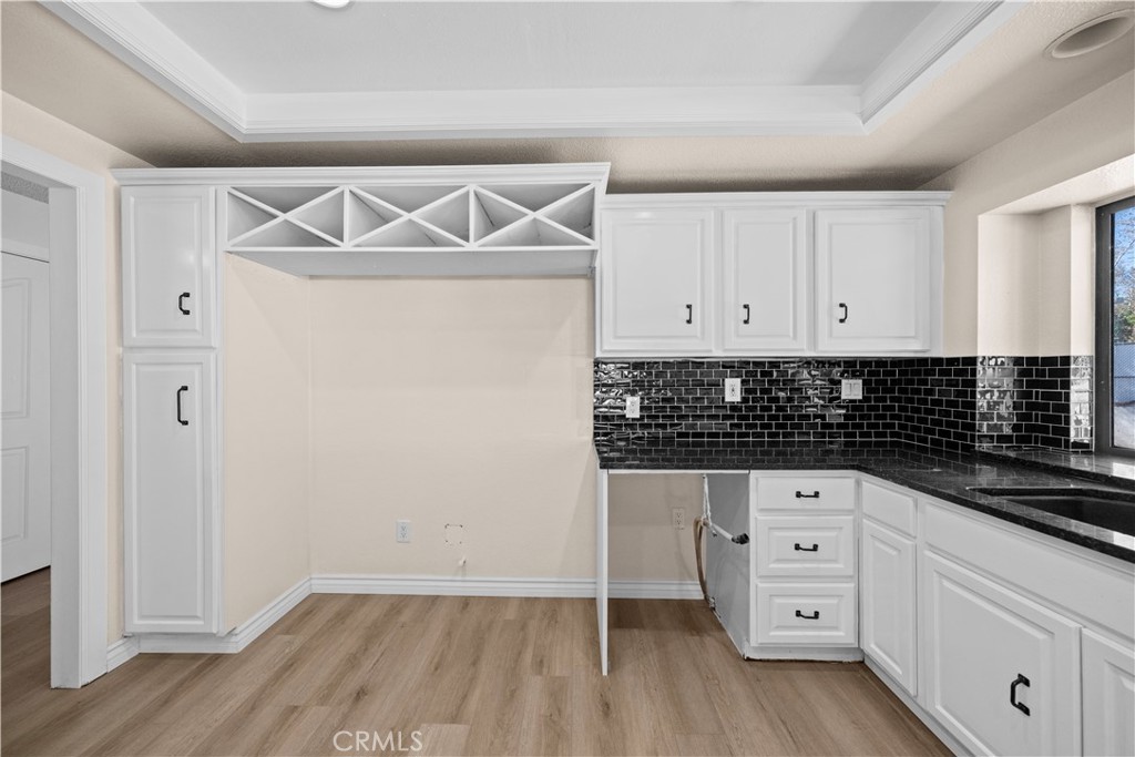 5498 Shadow Lane Rancho Cucamonga, CA 91737 - Photo 10 of 51 a kitchen with white cabinets and window
