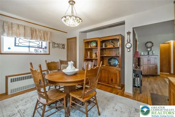 a view of a dining room with furniture and window