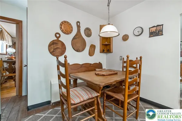 a view of a dining area with furniture and chandelier