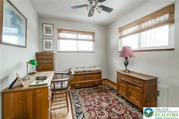 a bedroom with furniture and a window