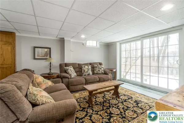 a living room with furniture and a large window