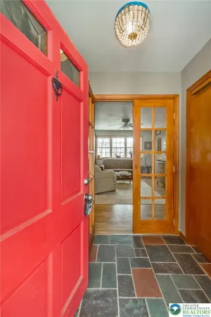 a room with black door and a glass door shower