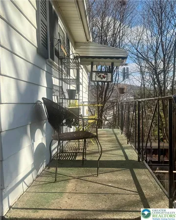 a view of a backyard with large trees