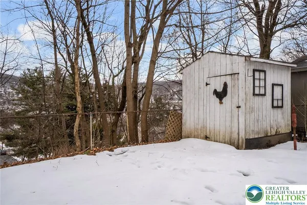 a view of snow on the side of the road