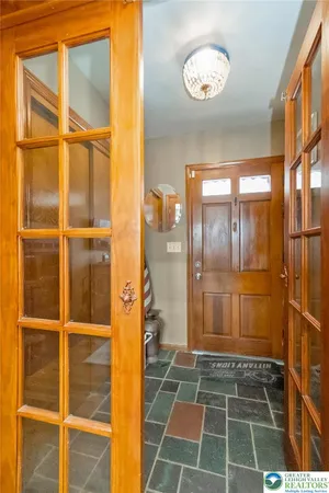 a bathroom with a glass door shower and a bathtub