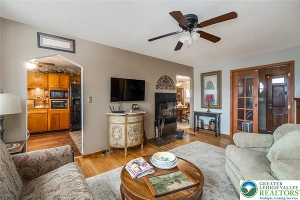 a living room with furniture and a flat screen tv