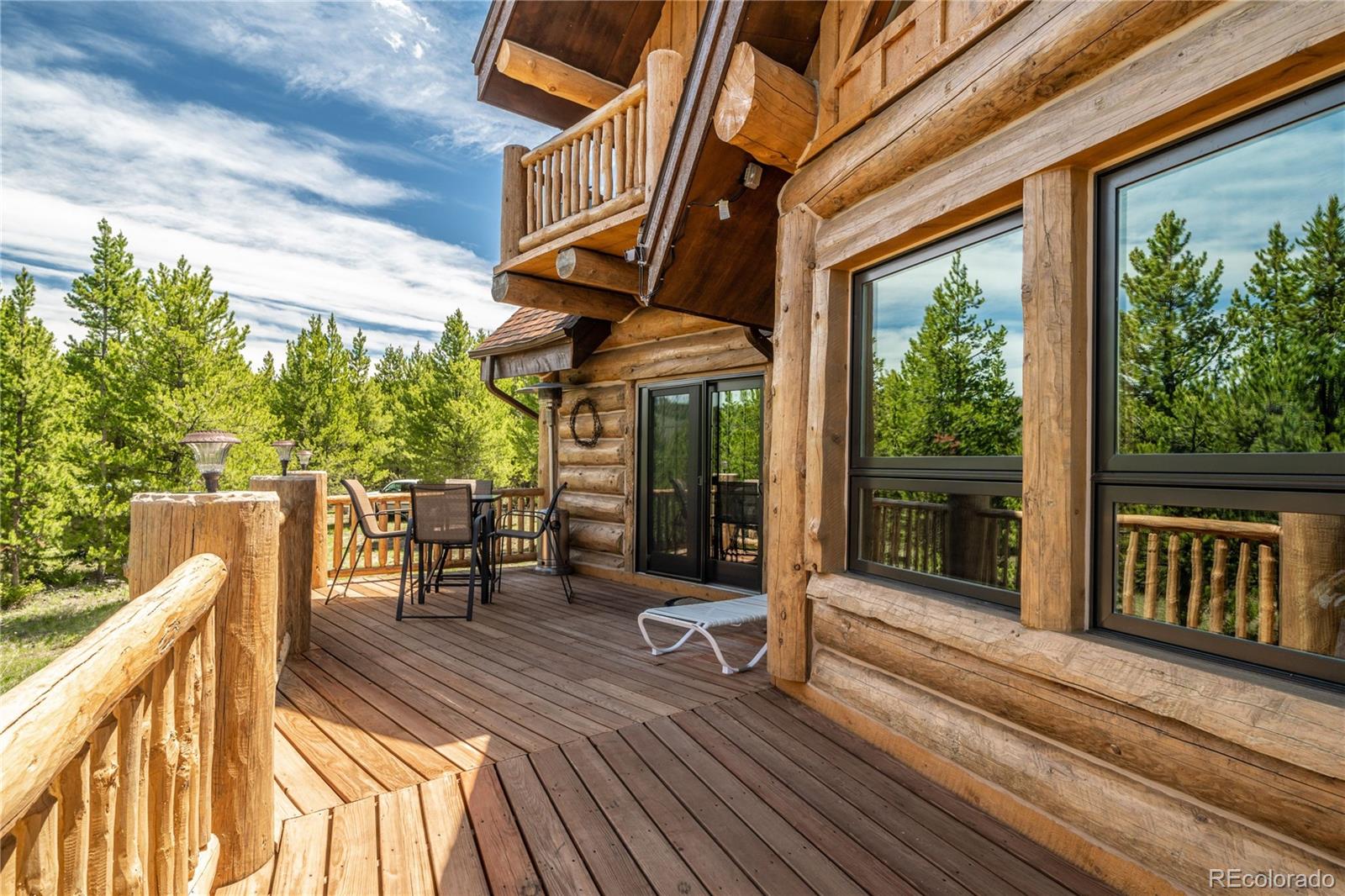 160 County Road Tabernash, CO 80478 - Photo 16 of 33 a view of a two chair and tables in the balcony